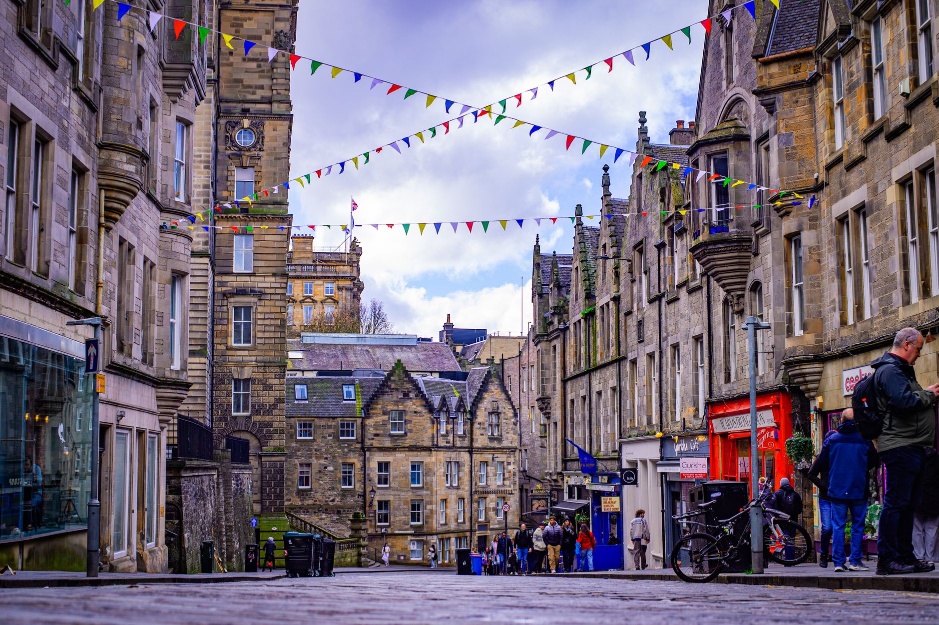Charming Edinburgh street scene with colorful bunting in the Scottish Highlands.